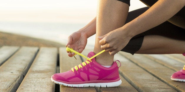 Young woman is running in sunny nature