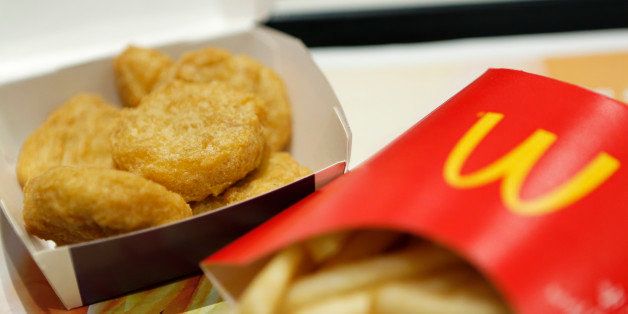 A box of chicken nuggets, left, sits beside a portion of french fries in this arranged photograph at a McDonald's restaurant, operated by McDonald's Holdings Co. Japan Ltd., in Tokyo, Japan, on Wednesday, Jan.7, 2015. McDonald's Corp.'s Japan business and Cargill Inc. are investigating complaints objects were found in chicken nuggets made by a Cargill factory in Thailand, the restaurant chainￃﾃￂﾢs second food safety crisis in six months. Photographer: Kiyoshi Ota/Bloomberg via Getty Images