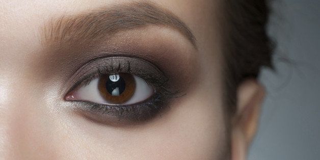 Closeup of beautiful woman eye with stylish bright makeup, smoky eyes