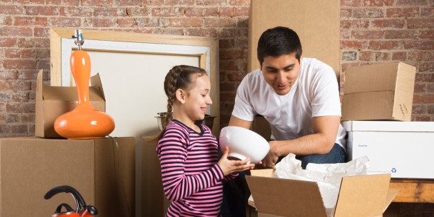 Father and daughter with moving boxes