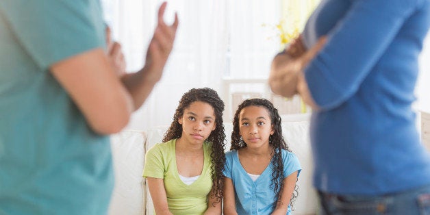 USA, New Jersey, Jersey City, Parents quarreling, with daughters (10-13) in background