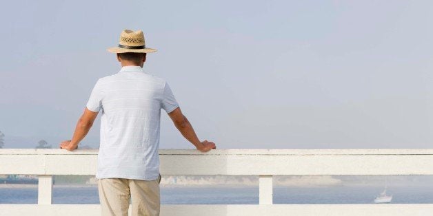 Back view of man on pier, Santa Cruz, California