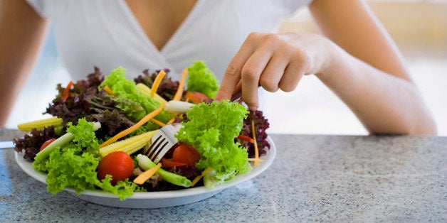 Woman eating salad