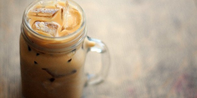 Iced coffee on wooden table.