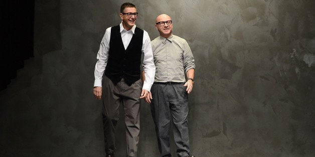 MILAN, ITALY - FEBRUARY 24: Stefano Gabbana and Domenico Dolce acknowledge the applause of the audience after the runway at