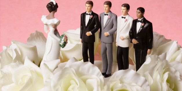 Bride figure on wedding cake with a choice of four grooms
