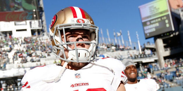 SEATTLE, WA - DECEMBER 14: Chris Borland #50 of the San Francisco 49ers stands on the field prior to the game against the Seattle Seahawks at CenturyLink Field on December 14, 2014 in Seattle, Washington. The Seahawks defeated the 49ers 17-7. (Photo by Michael Zagaris/San Francisco 49ers/Getty Images)
