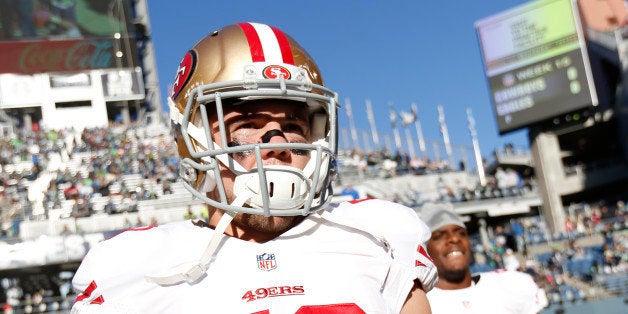 SEATTLE, WA - DECEMBER 14: Chris Borland #50 of the San Francisco 49ers stands on the field prior to the game against the Seattle Seahawks at CenturyLink Field on December 14, 2014 in Seattle, Washington. The Seahawks defeated the 49ers 17-7. (Photo by Michael Zagaris/San Francisco 49ers/Getty Images) 