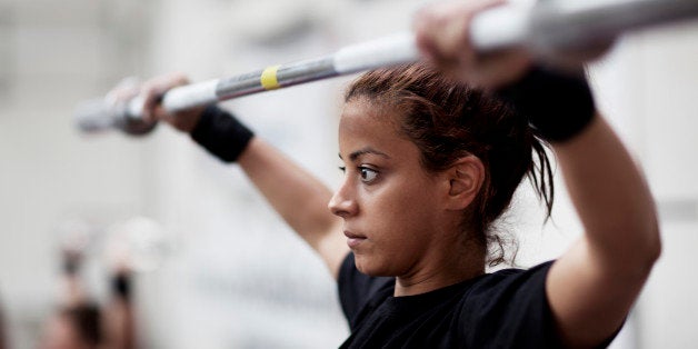 Young woman training in fitness center