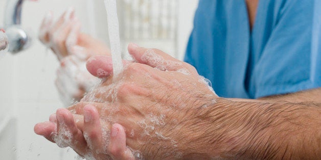 Surgeons washing hands before operation