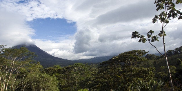 The Arenal Volcano's peak is often shrouded by clouds, Costa Rica.