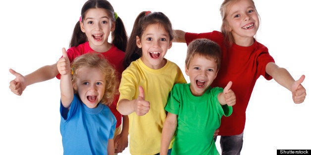 group of happy children with...