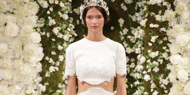 NEW YORK, NY - OCTOBER 10: A model walks the runway during the Reem Acra Fall 2015 Bridal Collection show at the Reem Acra B