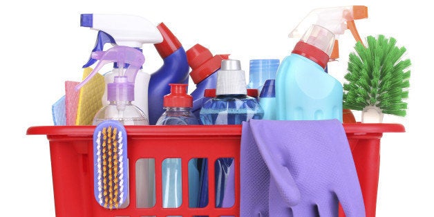 Cleaning items in plastic basket isolated on whiteCleaning items isolated on whiteBucket with cleaning items on blue background