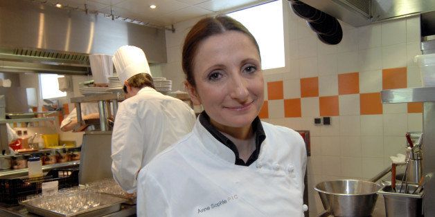 Chef Anne-Sophie Pic poses in the kitchen of her restaurant, in Valence southern France, Wednesday, Feb. 21, 2007. Anne-Sophie Pic, the latest in a line of great chefs, was awarded the maximum three stars in the new Michelin Guide for her restaurant , becoming the fourth woman ever to win the honor. (AP Photo/Claude Paris)