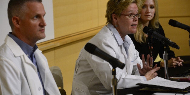 AURORA, CO - SEPTEMBER 29: Medical experts address the media during a press conference at the Children's Hospital Colorado in Aurora, CO regarding the update on the respiratory enterovirus D68 and the potential link to muscle weakness. From left to right are Dr. Sam Dominguez, Children's Hospital Colorado Microbial Epidemiologist, Dr. Chris Nyquist, Children's Hospital Colorado Medical Director, Infection Prevention and Control, and Dr. Joyce Oleszek, Children's Hospital Colorado, Pediatric Rehabilitation Medicine. (Kathryn Scott Osler/The Denver Post via Getty Images)