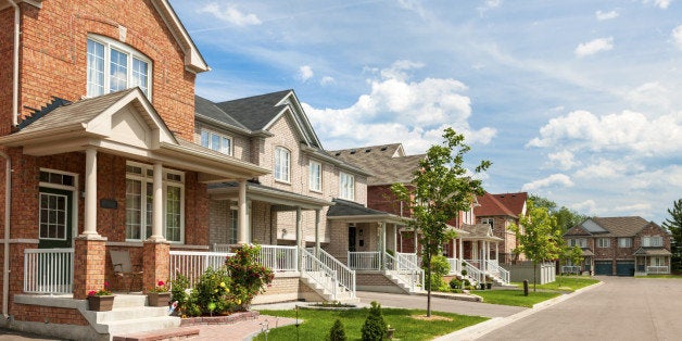 Suburban residential street with red brick houses