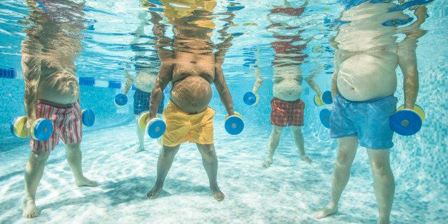5 overweight senior men in an aquafit lesson using dumbbells