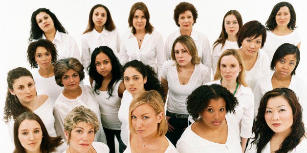 Studio Portrait of a Mixed Age, Multiethnic, Large Group of Displeased Women Wearing White Tops