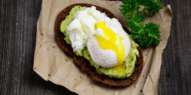 Rye toast with mashed avocado and poached egg