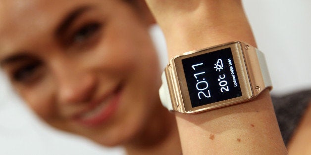 BERLIN, GERMANY - SEPTEMBER 04: A hostess presents the new Samsung Galaxy Gear smart watch at the Samsung Unpacked 2013 Episode 2 at Tempodrom on September 4, 2013 in Berlin, Germany. Samsung introduced a total of three new products at the event, on the eve of the IFA 2013 consumer electonics fair. (Photo by Sean Gallup/Getty Images)