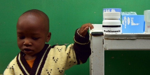 John, 3, who suffers from multi-drug-resistant tubeculosis (MDR-TB), waits by a medicine trolley for his medication to be prepared at a Medecins Sans Frontieres (MSF)-run clinic in Nairobi on March 24, 2015, World Tubeclosis Day. Globally, TB continues to kill 1.5 to 2 million people each year and remains the leading cause of death in people with HIV. In 2013, there were 90,000 new cases of TB diagnosed in Kenya and an estimated 20,000 cases went undetected. AFP PHOTO / TONY KARUMBA (Photo credit should read TONY KARUMBA/AFP/Getty Images)