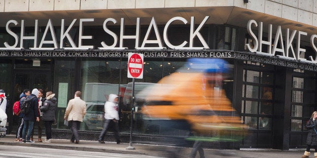 CHICAGO, IL - JANUARY 28: A sign hangs over the entrance of a Shake Shack restaurant on January 28, 2015 in Chicago, Illinois. The burger chain, with currently has 63 locations, is expected to go public this week with an IPO priced between $17 to $19 a share. The company will trade on the New York Stock Exchange under the ticker symbol SHAK. (Photo by Scott Olson/Getty Images)