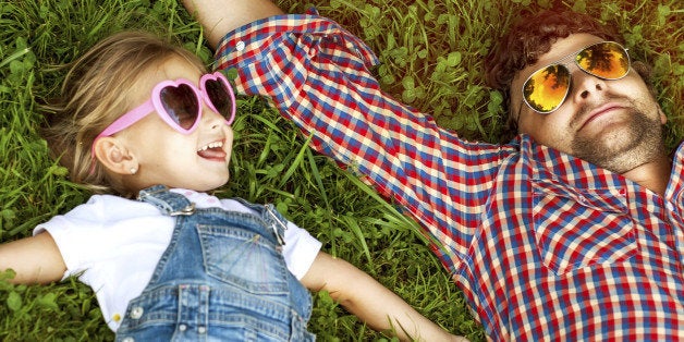 Father with daughter In Park smiling happy