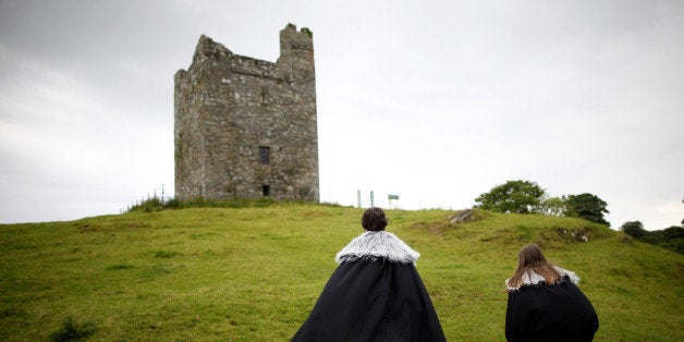 In this June 13, 2014 photo, Game of Thrones tourists visit Audleys field and castle, castleward, Strangford, Northern Ireland. Audleys field and castle was used for filming season 1 as King Robert Baratheon and his retinue arrive at Winterfell. (AP Photo/Peter Morrison)