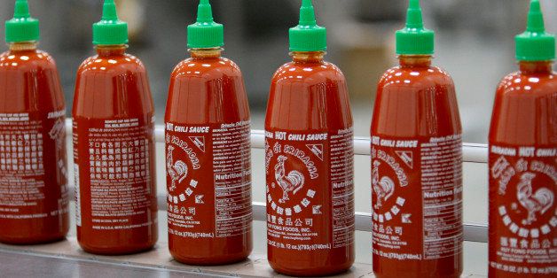 IRWINDALE, CA - MAY 14: Sriracha Hot Chili Sauce is bottled at the Huy Fong Foods plant on May 14, 2014 in Irwindale, California. Huy Fong Foods is at legals odds with the Irwindale City Council and residents of nearby houses where some have complained of ill effects caused by strong pepper odors during the fall pepper crushing season at the plant. (Photo by David McNew/Getty Images)