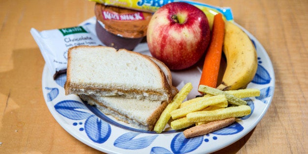 JAMAICA PLAIN, MA - SEPTEMBER 5: Colleen Scanlan's prepared school lunch for her two sons, photographed at their home in Jamaica Plain. Clockwise from bottom left - Peanut butter sandwich, chocolate brownie, pudding, yogurt, an apple, carrot, banana, and veggie straws. (Photo by Aram Boghosian for The Boston Globe via Getty Images)