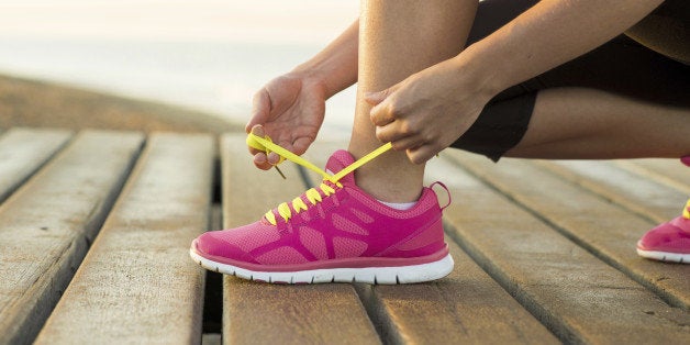 Young woman is running in sunny nature