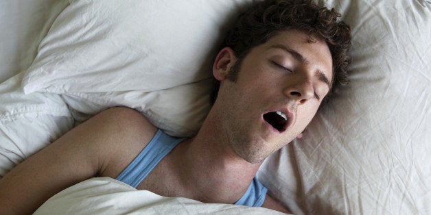 Man sleeping and snoring, overhead view