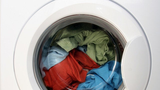 Colorful shirt and trousers in a white laundry.