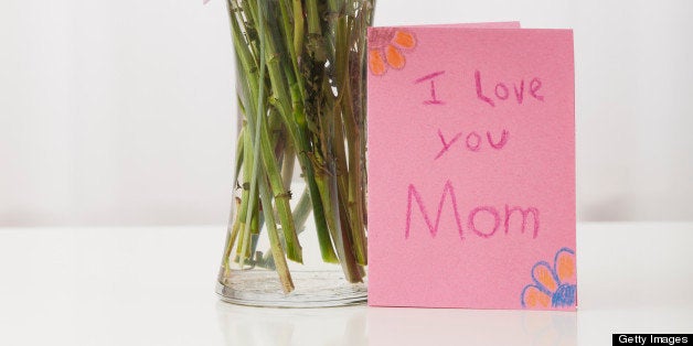 Bouquet in vase with greeting card for Mother's Day