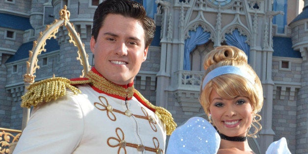 LAKE BUENA VISTA, FL - JUNE 24: In this handout photo provided by Disney Parks, singer Ariana Grande (R) poses with Cinderella and Prince Charming in front of Cinderella Castle in the Magic Kingdom June 24, 2014 in Lake Buena Vista, Florida. Grande is celebrating her 21st birthday with dozens of family and friends at Walt Disney World. (Photo by Chloe Rice/Disney Parks via Getty Images)