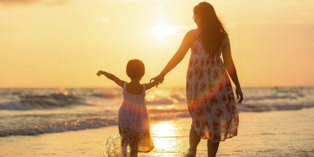 Mother with her daughter on the beach