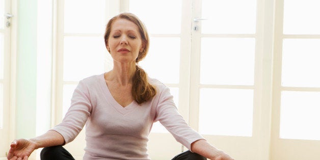 Woman sitting in yoga position