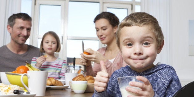 Family of four having healthy breakfast