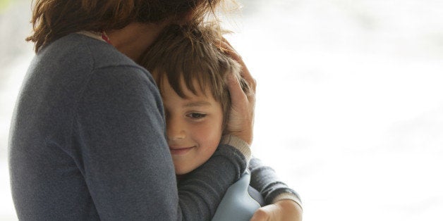 Mother and son hugging