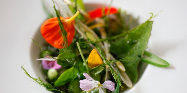 This photo taken Sept. 8, 2010, shows a dish of foraged foods called wild peas and beans in various forms and river vegetable made by chef Josh Skenes at the Saison restaurant in San Francisco. Skenes, a chef who trained under famed chef Jean-George Vongerichten, incorporates these wild elements into the menu at his San Francisco restaurant. Foraging for food, surely one of humanity's earliest pursuits, is making a comeback as urbanites combine their pursuit of novelty and flavor with an urge to connect to the environment and live true to stringent ethical eating standards. (AP Photo/Eric Risberg)