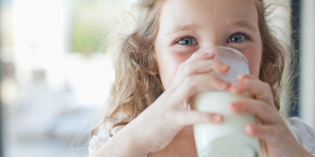 Girl drinking glass of milk