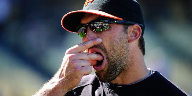 LOS ANGELES, CA - MARCH 31: Mark DeRosa #7 of the San Francisco Giants uses smokeless tobacco during warm ups prior to playing the Los Angeles Dodgers on Opening Day at Dodger Stadium on March 31, 2011 in Los Angeles, California. (Photo by Kevork Djansezian/Getty Images)