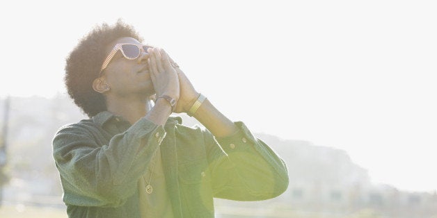 Man standing outdoors praying