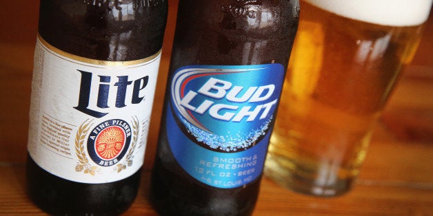 CHICAGO, IL - SEPTEMBER 15: In this photo illustration, bottles of Miller Lite and Bud Light beer that are products of SABMiller and Anheuser-Busch InBev (respectively) are shown on September 15, 2014 in Chicago. Illinois. Shares of SABMiller have surged to an all-time high today on speculation of a takeover bid by Anheuser-Busch InBev, the world's largest brewer. (Photo Illustration by Scott Olson/Getty Images)