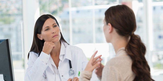 Female doctor discussing with a patient