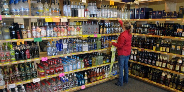 Kathy Paschkow, Store Manager at Idaho Liquor Store #118 in Nampa, Idaho changes price tags on the shelves of this Nampa Liquor Store, Monday, Dec. 1, 2008. Store #118 along with two other State Liquor Stores and three contract stores in Canyon County will now be permitted to sell alcohol on Sundays following the approval of a resolution by County Commissioners. (AP Photo/Idaho Press-Tribune, Charlie Litchfield) ** MANDATORY CREDIT **