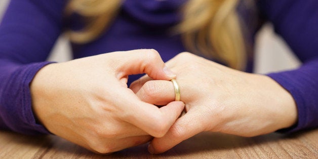 woman is taking off the wedding ring