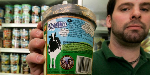 Ben Powden, Frozen Foods Manager at Lantman's Supermarket in Hinesburg, Vt., holds a Ben & Jerry's ice cream pint, Monday, Feb. 4, 2008, which shows a label, at center, displaying the company's stance against Recombinant Bovine Growth Hormone. Ben & Jerry's, one of the first companies to label its ice cream as free of a synthetic hormone, is protesting a move to restrict such labeling by some states that are urged on by a newly formed farmers' group, supported by Monsanto. (AP Photo/Alden Pellett)