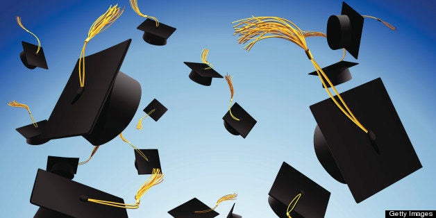 Graduation caps thrown in the air